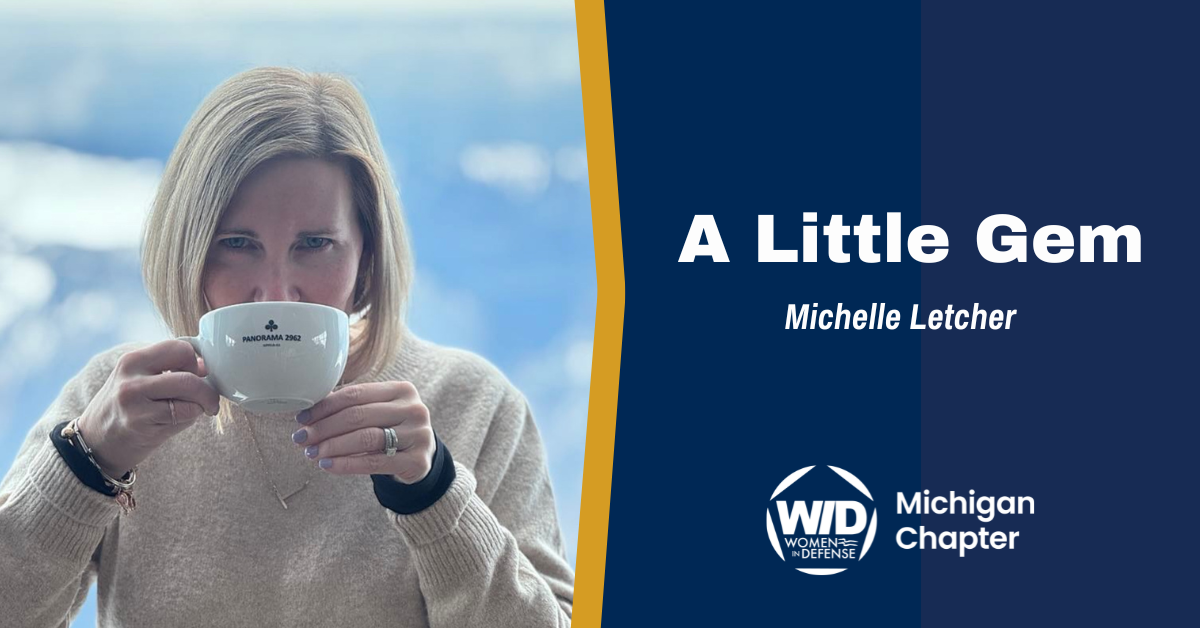 Michelle Letcher, founder and CEO of Break Trail, LLC sips from a coffee mug.