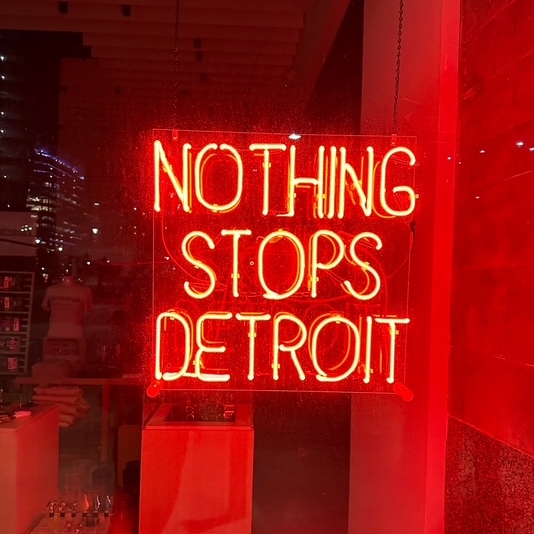 Red neon sign saying Nothing Stops Detroit